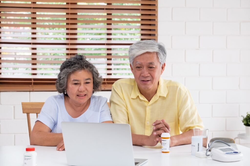 Mature couple participates in telehealth appointment