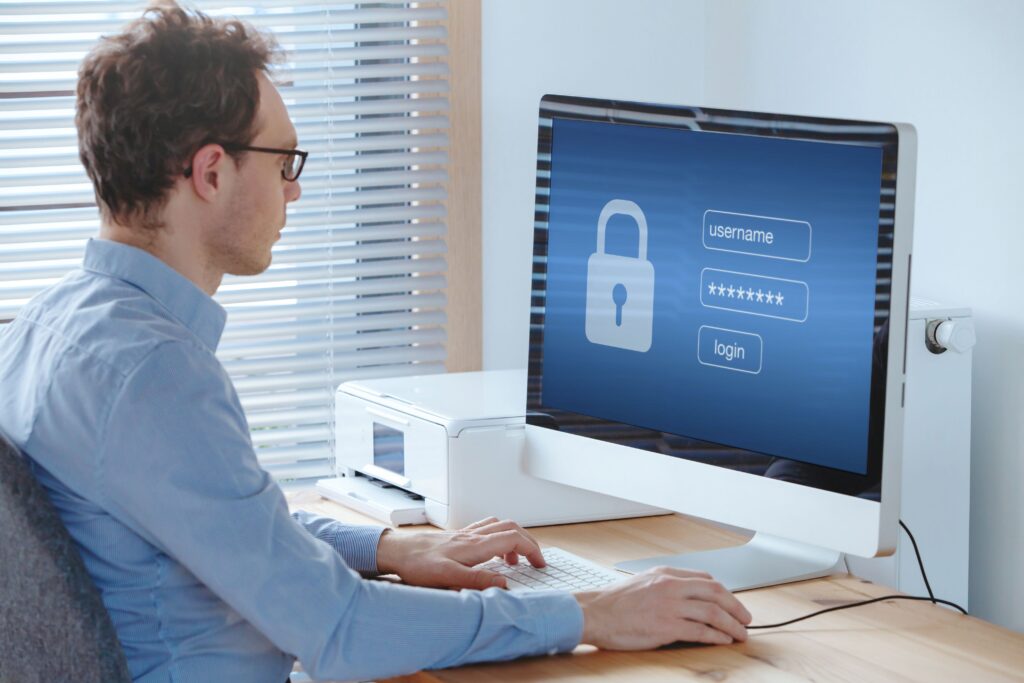Man entering password on computer